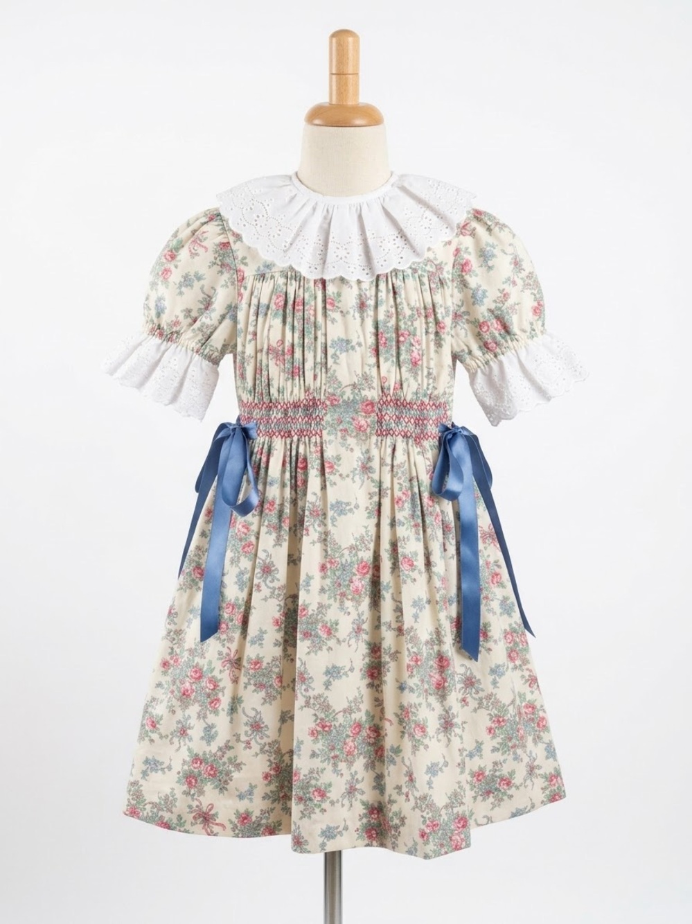 Vintage Floral Smocked Girls' Cream Dress with Blue Ribbon